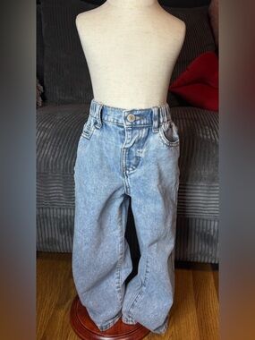 Kids size 5y light blue denim jeans with pink bow prints on both pockets